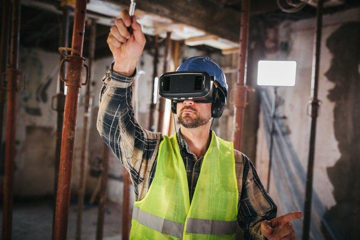 Construction worker wearing smart goggles